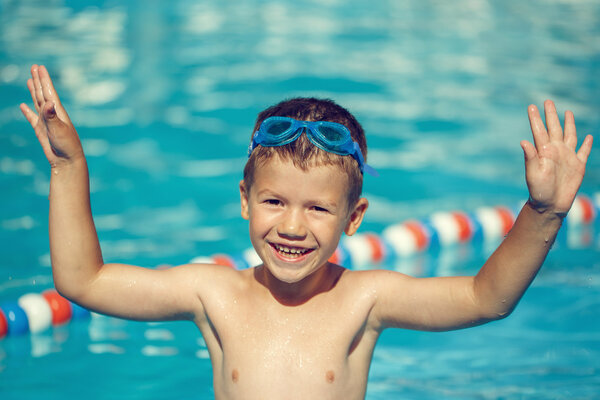 Happy little boy enjoy summer holiday in pool vintage