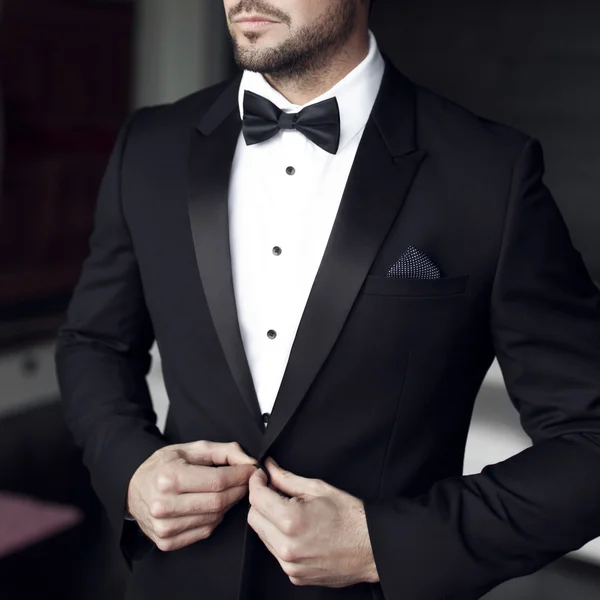 Sexy man in tuxedo and bow tie — Stock Photo, Image