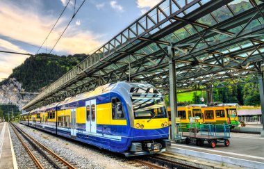 Passenger trains at Lauterbrunnen railway station in Switzerland
