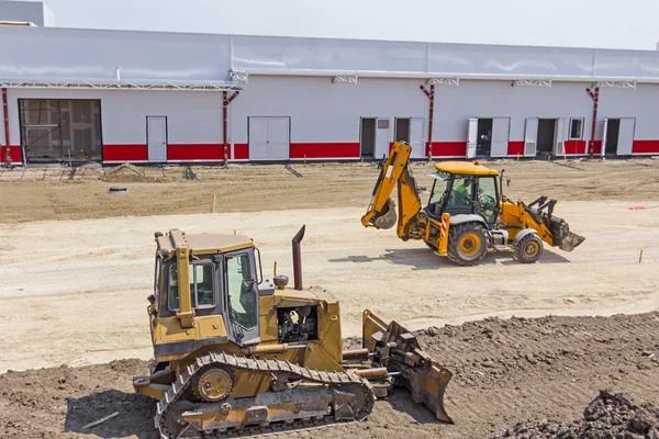 Buldozer makine inşaat alanı tesviye. — Stok fotoğraf