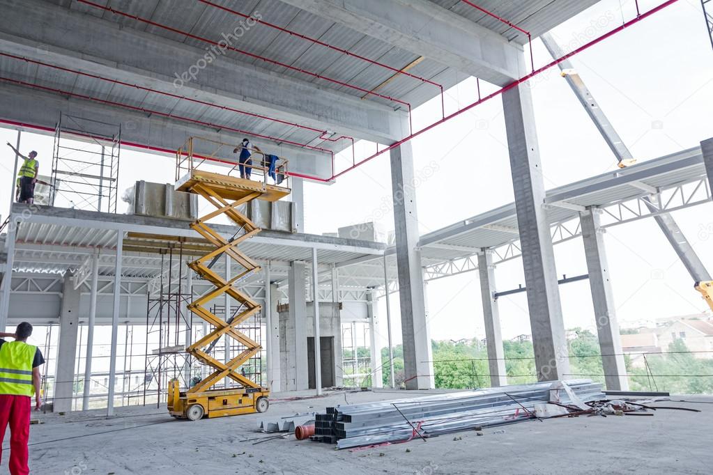 Scissor lift platform on a construction site.