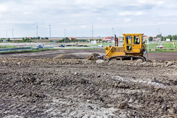Bulldozer machine is herverdeling bouwplaats — Stockfoto