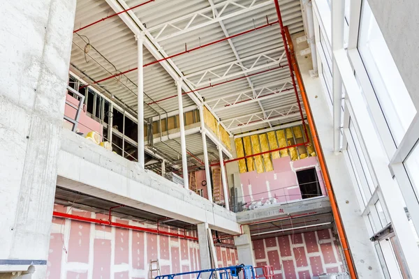 View on indoor construction site of unfinished modern large show — Stock Photo, Image