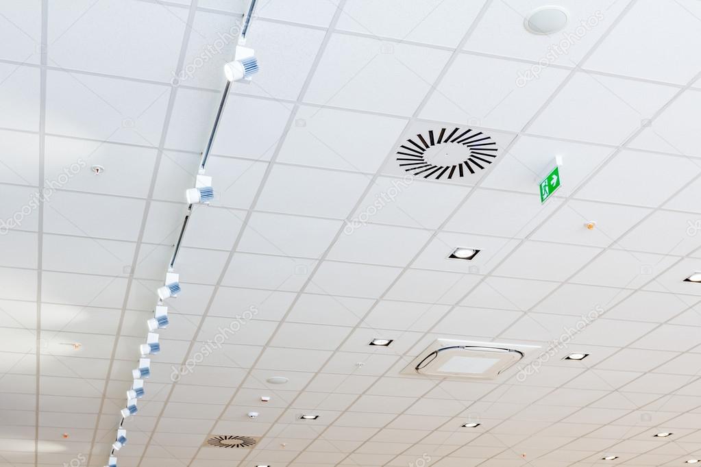 Modern Office Ceiling With Air Duct And Lamps Stock Photo