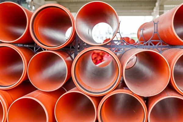 Arranged PVC tubes pipes stacked in rows pattern — Stock Photo, Image
