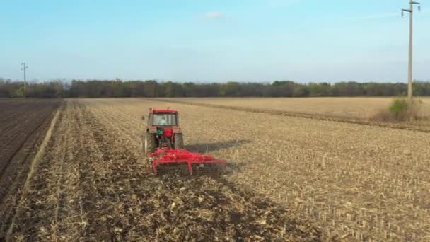 Dolly Move Shot Tractor Pulling Machine Harrowing Arable Field Preparing — Stock Video