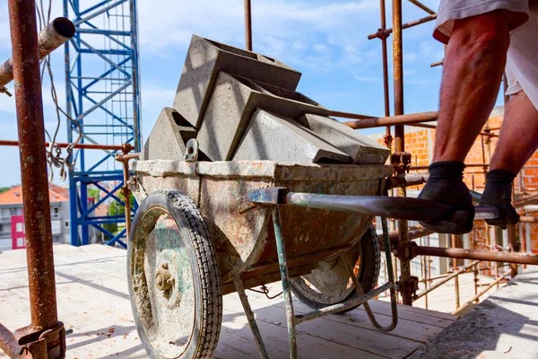 Worker Helping Crane Keep Balance Direction Transport Wheelbarrow Laden Blocks — Stock Photo, Image