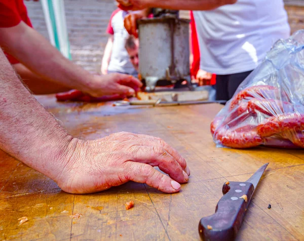 Butcher\'s hand on wooden table waiting, on break, pause.