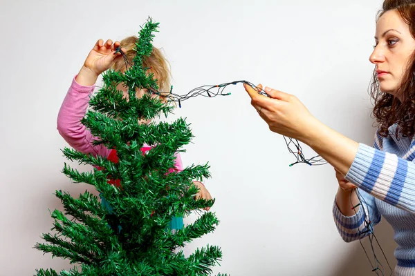 Mother Giving Hand Her Daughter Place Shiny Decorative Strips Tassel — Stock Photo, Image