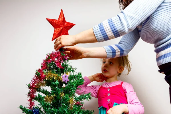 Mother Giving Hand Her Daughter Place Shiny Decorative Strips Tassel — Stock Photo, Image