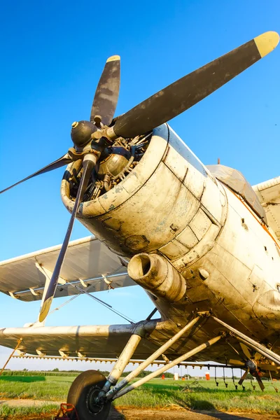 Biplane standing at sunset — Stock Photo, Image