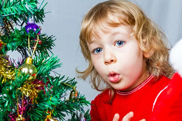 Happy small girl in Santa hat — Stock Photo, Image