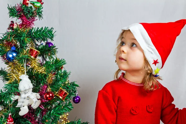 Happy small girl in Santa hat — Stock Photo, Image