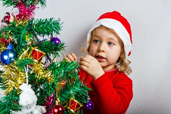 Happy small girl in Santa hat — Stock Photo, Image