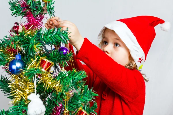 Gelukkig klein meisje in Kerstman hoed — Stockfoto