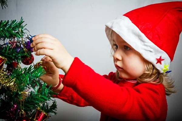 Happy small girl in Santa hat — Stock Photo, Image