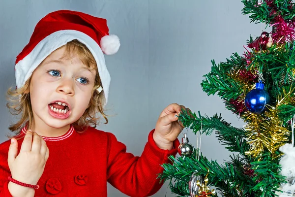 Onnellinen pieni tyttö Santa hattu — kuvapankkivalokuva