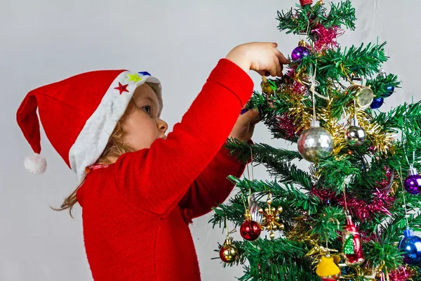 Gelukkig klein meisje in Kerstman hoed — Stockfoto