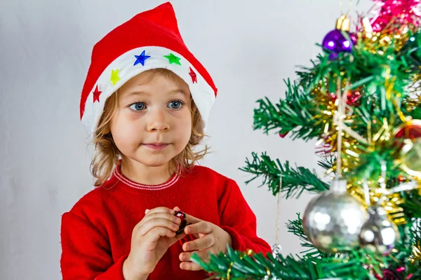 Happy small girl in Santa hat — Stock Photo, Image