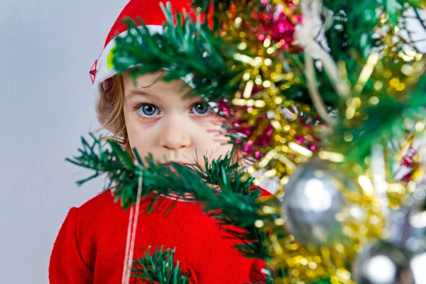 Happy small girl in Santa hat — Stock Photo, Image