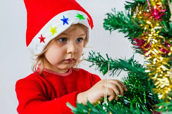 Gelukkig klein meisje in Kerstman hoed — Stockfoto