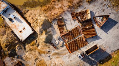 Above view on tow truck as he pull on mobile container for transportation metal.