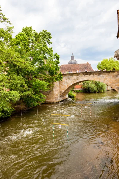 Town of Bamberg Canoe slalom s is a competitive sport with the aim to navigate a decked canoe or kayak through a course of hanging downstream or upstream gates on river rapids in the fastest time possible