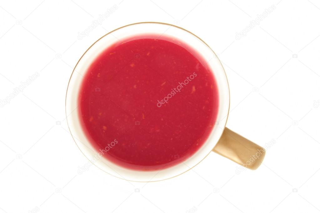 Berry Kisel drink in a cup on a white background - a top view 