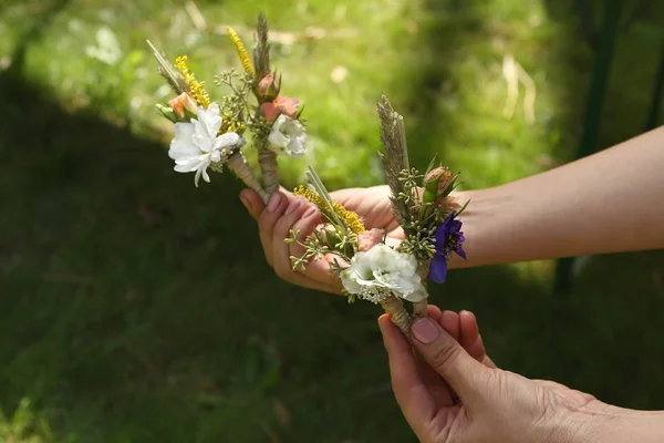 Forest Wedding Boutonnieres in hands — Stock Photo, Image