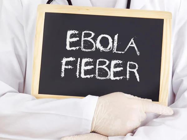 Doctor shows information: Ebola virus disease in german — Stock Photo, Image