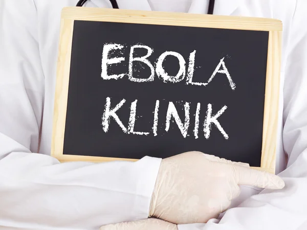 Doctor shows information: Ebola clinic in german language — Stock Photo, Image