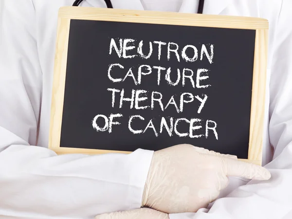 Doctor shows information: neutron capture therapy of cancer — Stock Photo, Image