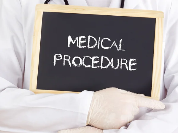 Doctor shows information: medical procedure — Stock Photo, Image