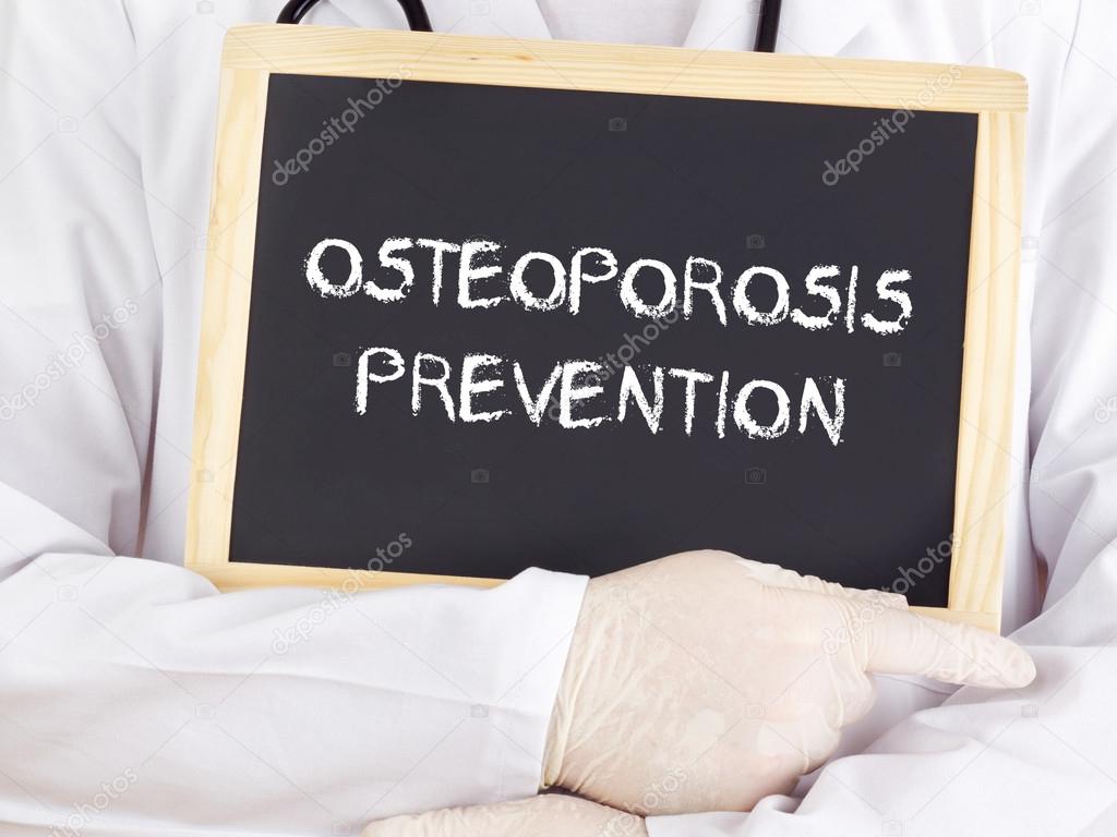 Doctor shows information osteoporosis prevention — Stock Photo