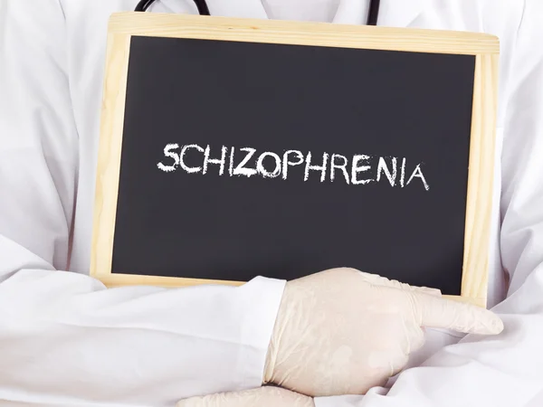 Doctor shows information: Schizophrenia — Stock Photo, Image