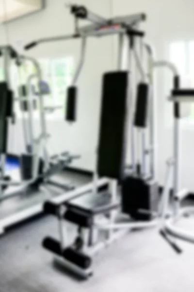 Abstrakt oskärpa fitnesscenter med utrustning som praktikant — Stockfoto