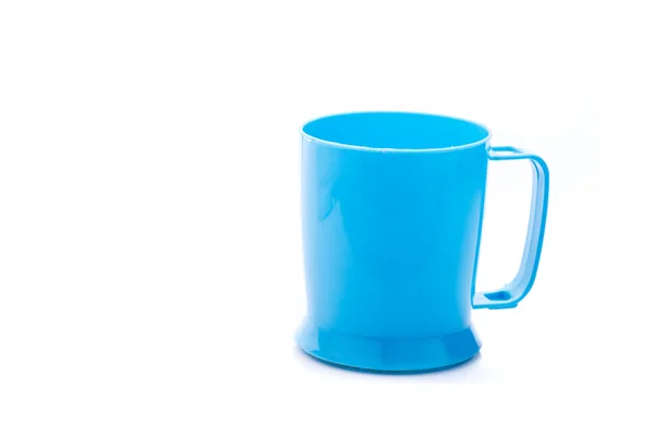 Blue plastic cup on white background with copyspace. — Stock Photo, Image