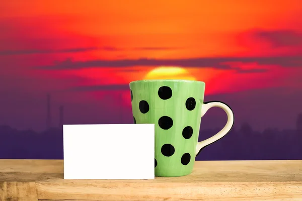 Green dot coffee cup — Stock Photo, Image