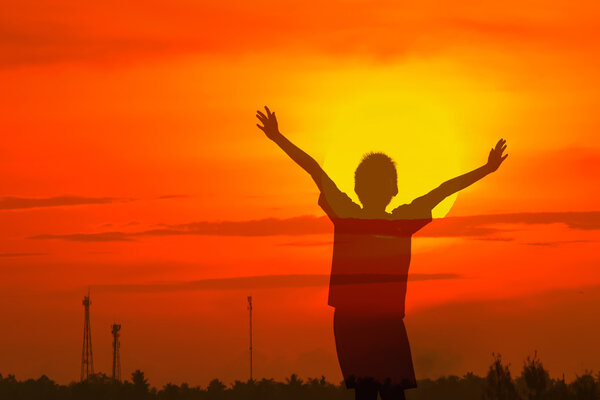 Boy raising his hands
