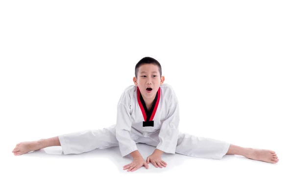 Giovane ragazzo in uniforme taekwondo — Foto Stock