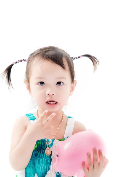 Happy Asian girl with piggybank. — Stock Photo, Image