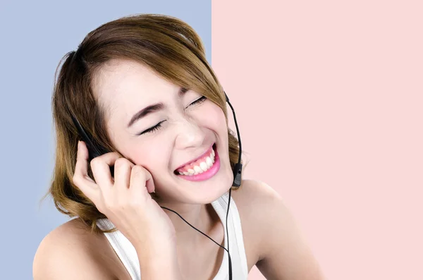 Happy Asian woman using headphone listening music,mp3 isolated o — Stock Photo, Image