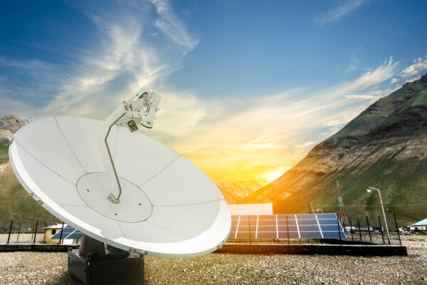 Solar panels, antenna booster with sun rise at Himalayan Mountai