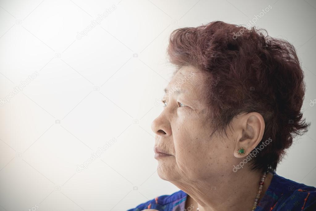 Portrait of smiling senior woman with copyspace