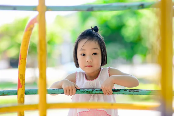 Asian little kid playing in the amusement park — Stock Photo, Image