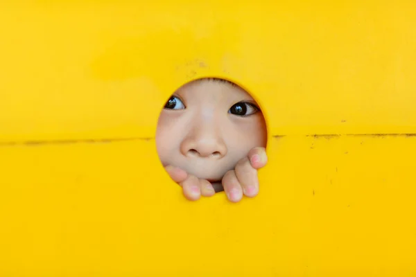 Asian little kid playing in the amusement park — Stock Photo, Image