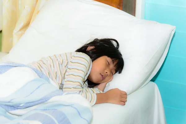 Adorable little girl sleeping in a bed — Stock Photo, Image