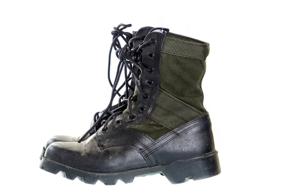 Old and dusty combat boots isolated on white. — Stock Photo, Image