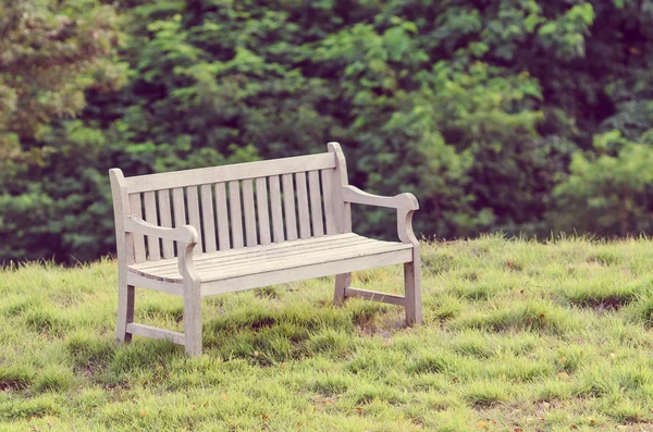 Wooden bench in the park with vintage style. — Stock Photo, Image