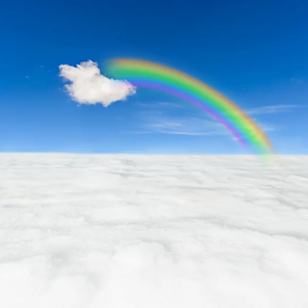 Snow field rainbow and blue sky — Stock Photo, Image